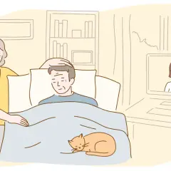 Kobieta troskliwie dba o leżącego mężczyznę, a kot grzeje go pod kołdrą. Na ekranie komputera widać uśmiechniętą pielęgniarkę, która udziela wskazówek, jak myć osobę leżącą.