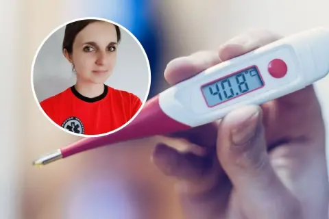 Kobieta w czerwonej koszulce patrzy na termometr pokazujący 40.8 stopni gorączki.
